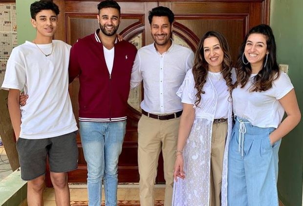 inside image of habhajan mann with wife and kids